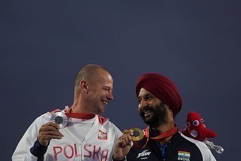 2024 Paralympic Games Archery: Gold medalist Harvinder Singh of India, right, and silver medalist Lukasz Ciszek of Poland